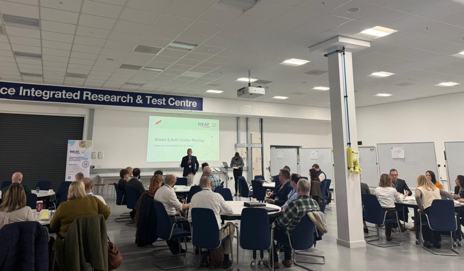 Photo of event attendees sat around tables at WEAF Bristol