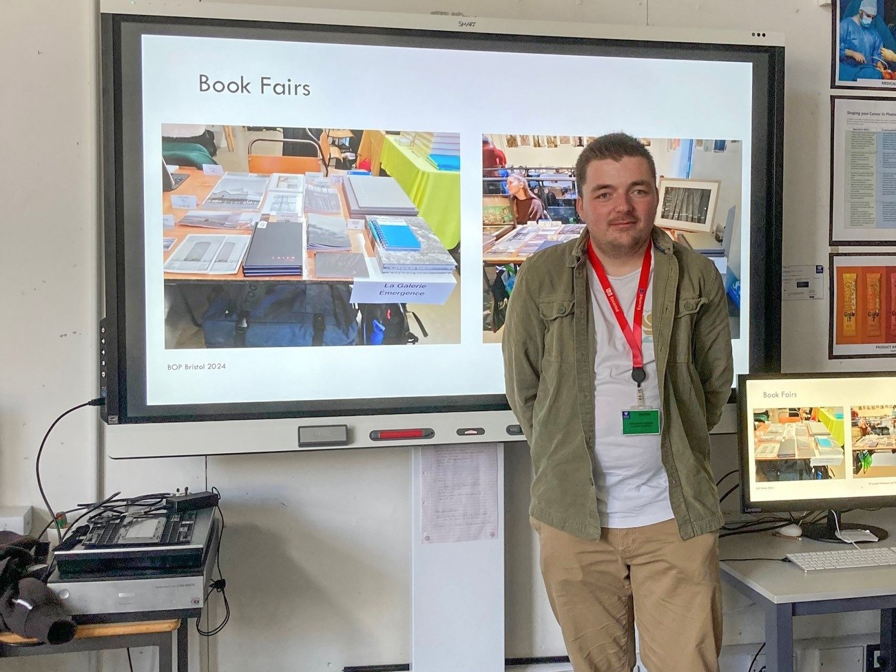 Josh standing in front of his presentation