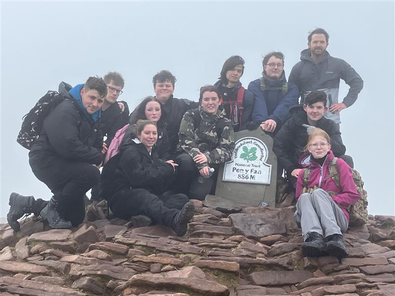 Students next to the Pen Y Fan summit point