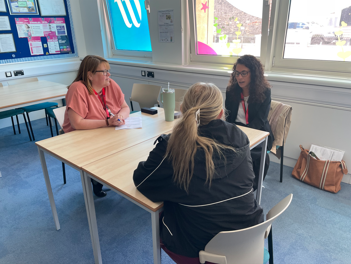 Amy and Debbie interviewing a student