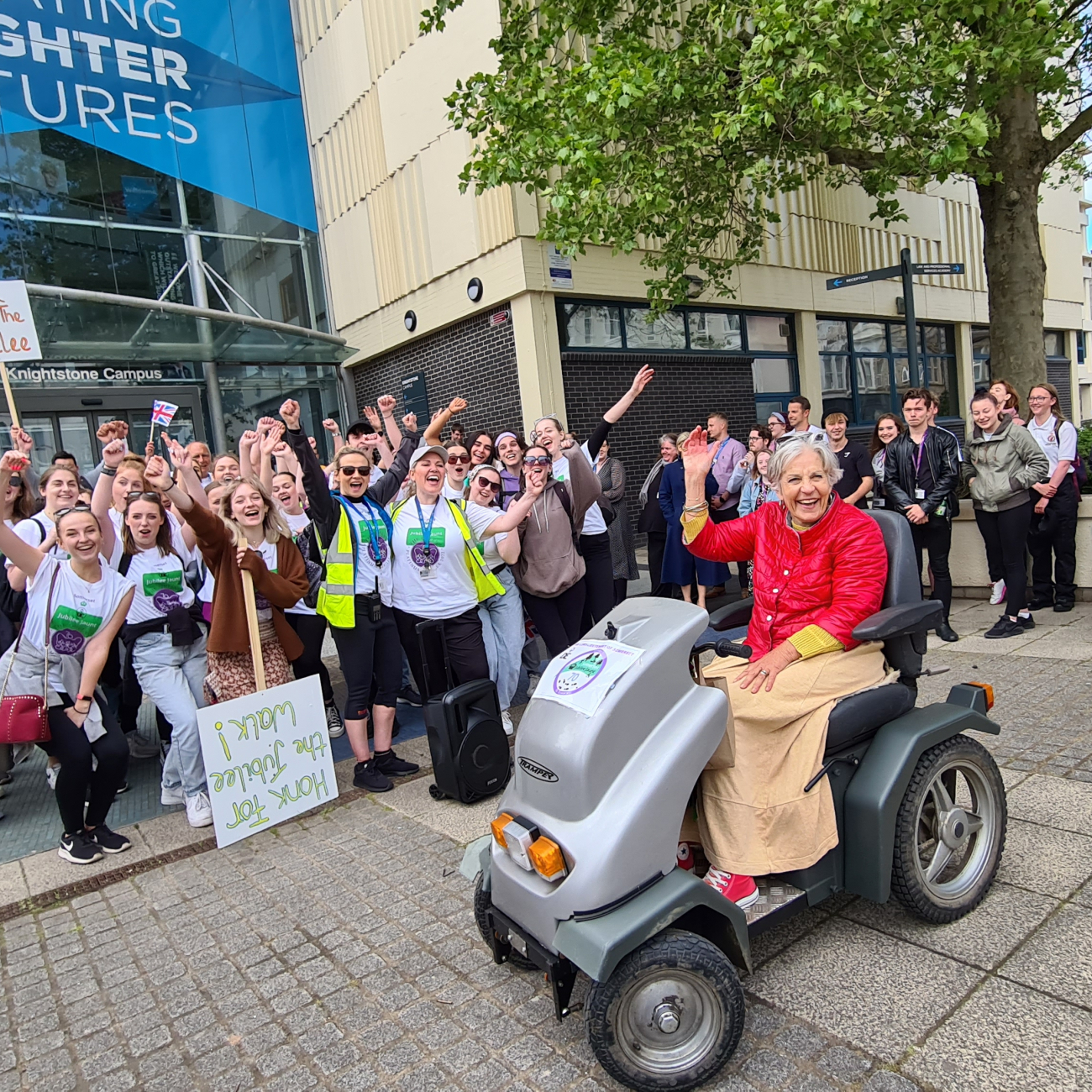 lord lieutenant mrs maw outside weston college cheering with students