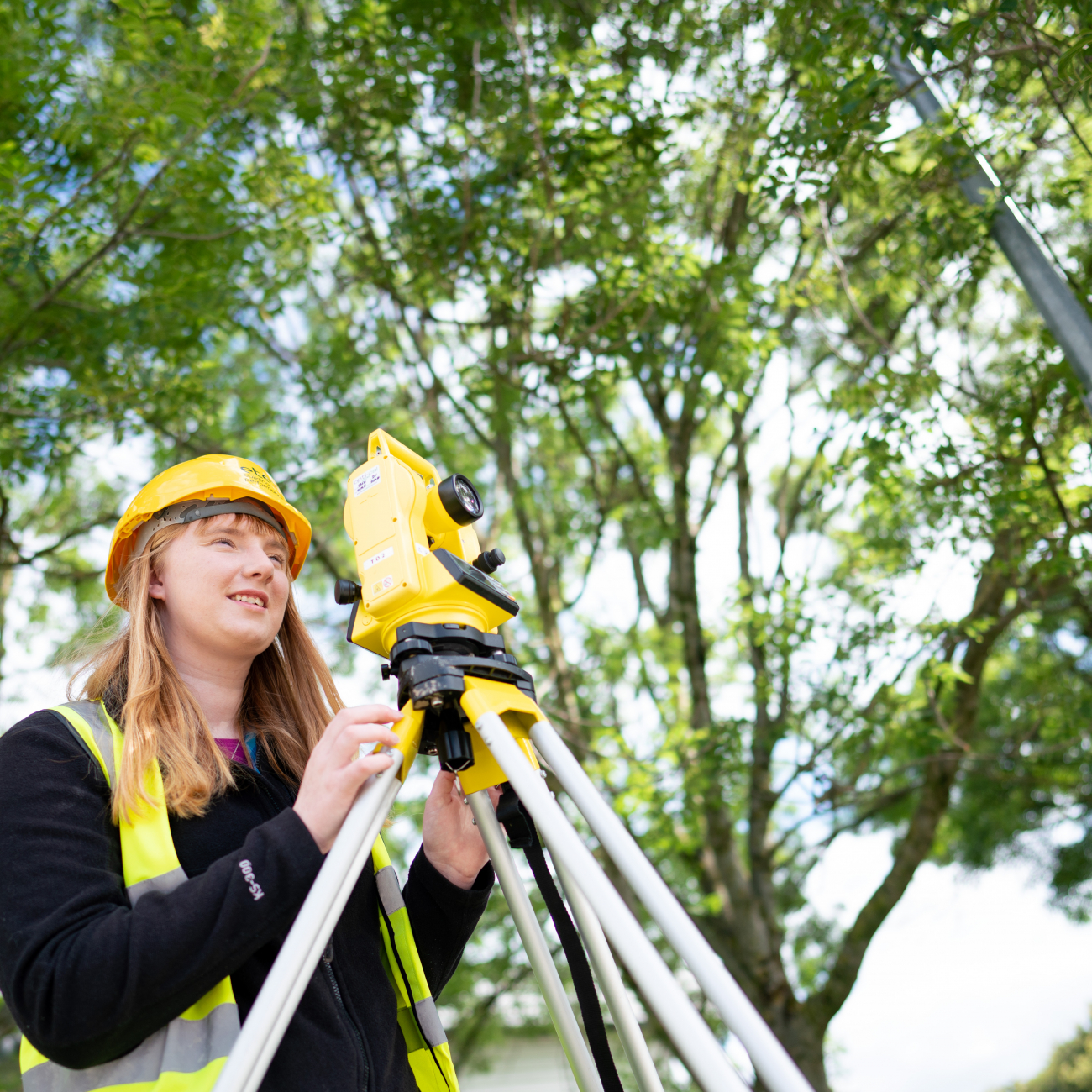 Charlotte using civil engineering equipment outside