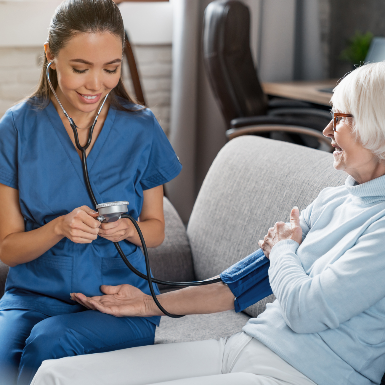 Nurse checking blood pressure of patient