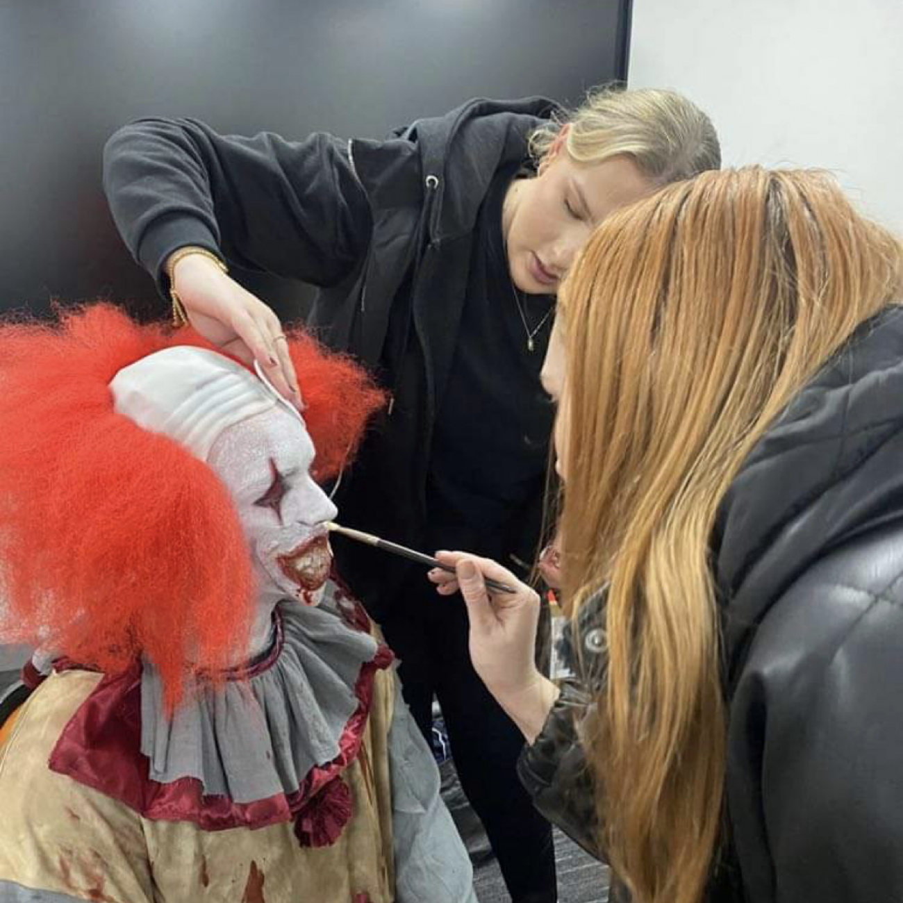 Student getting their makeup done