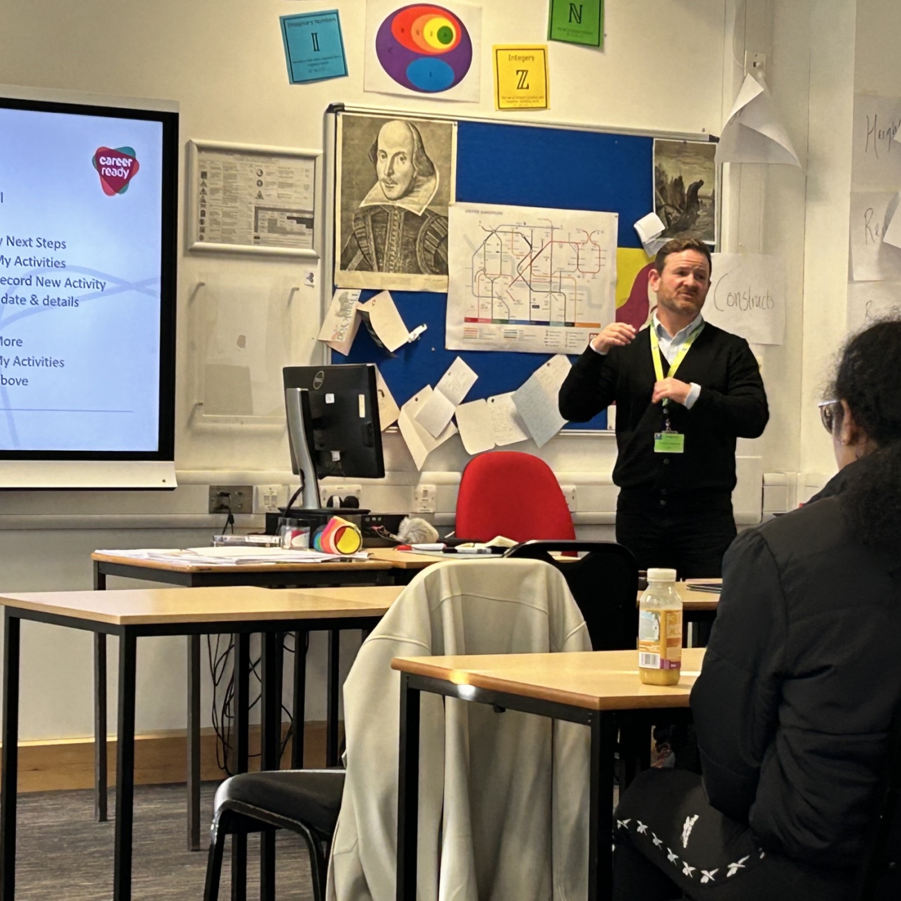 Employer mentor stood at the front of classroom presenting at the Career Ready workshop