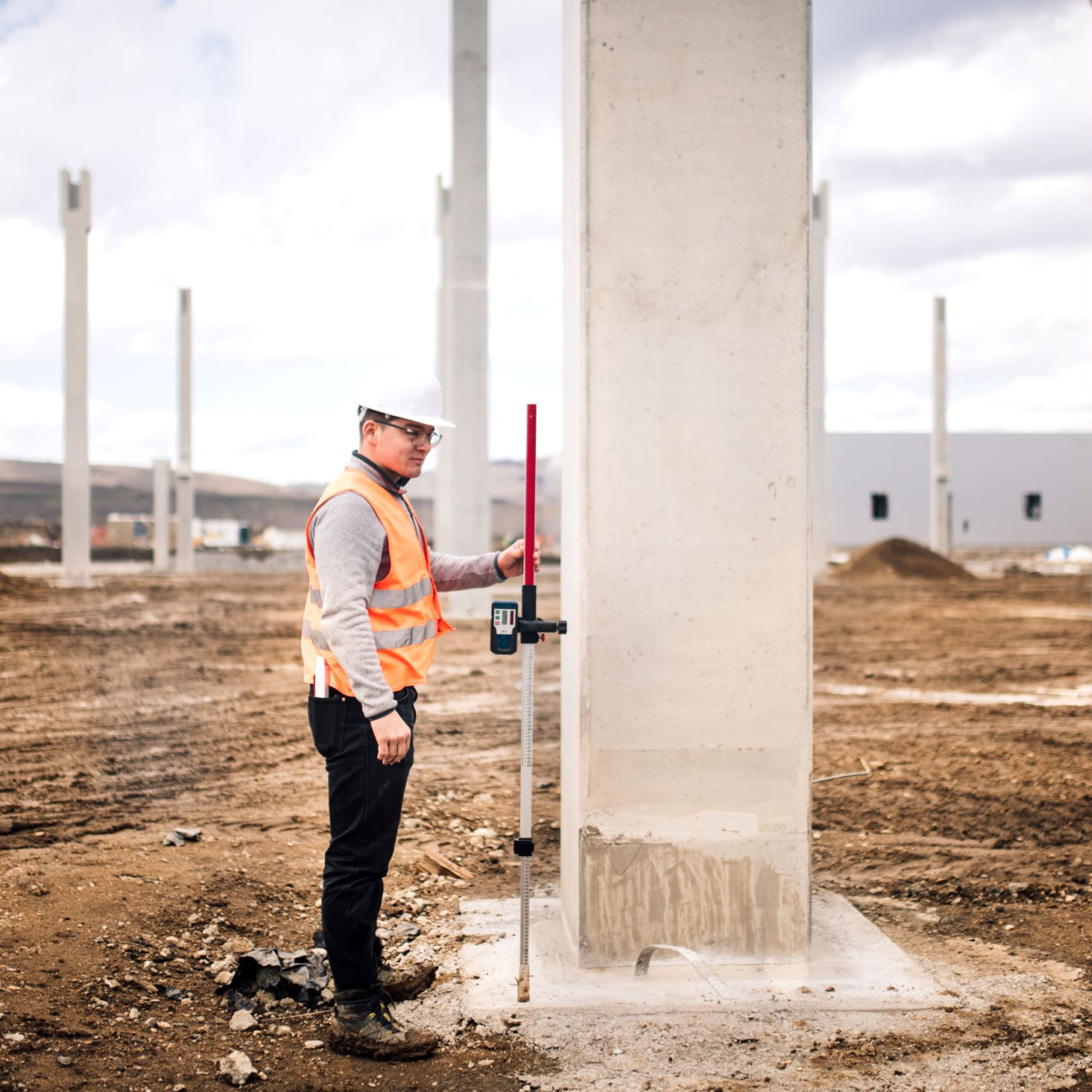 Civil Engineer surveying land with theodolite equipment