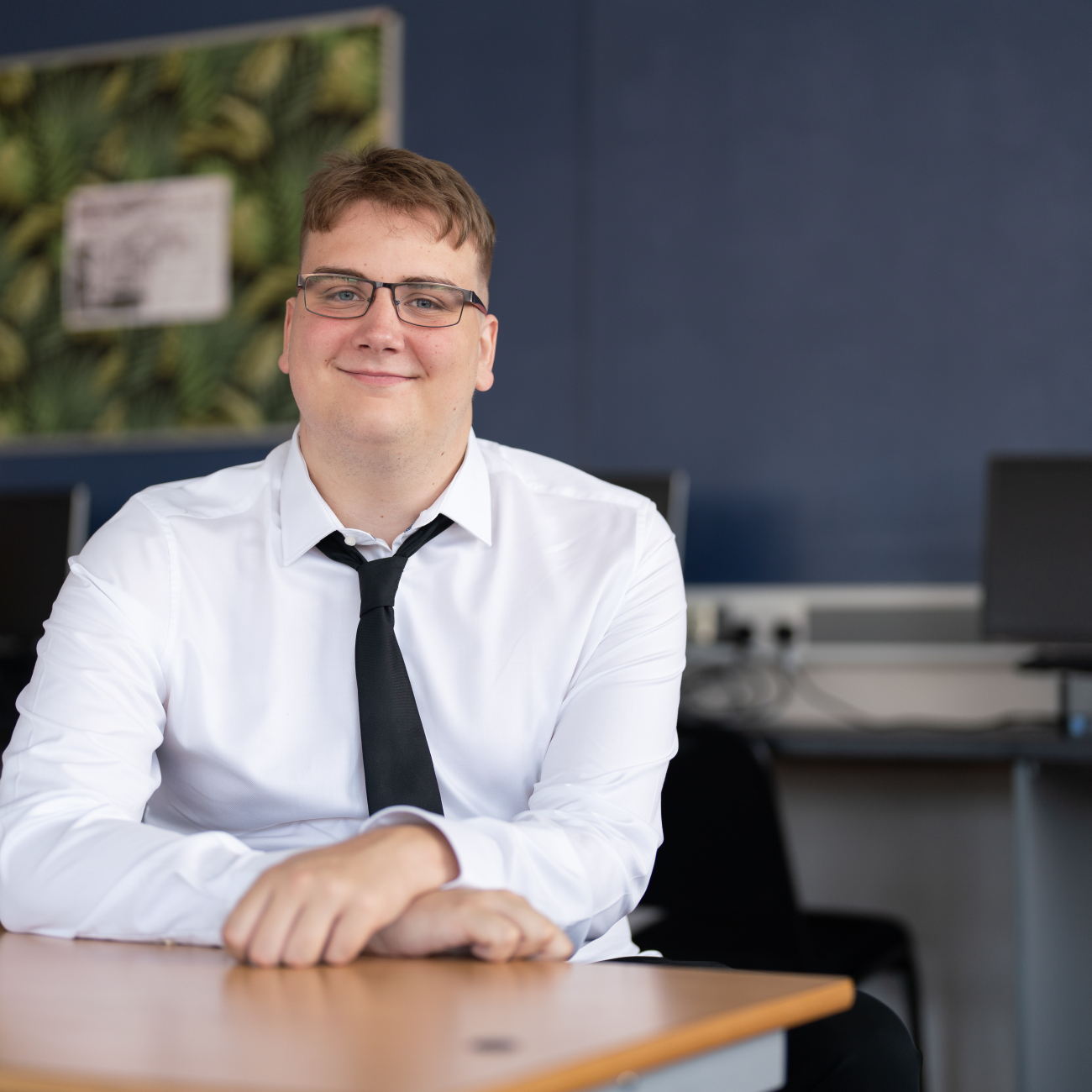 Toby Wells in classroom, smiling