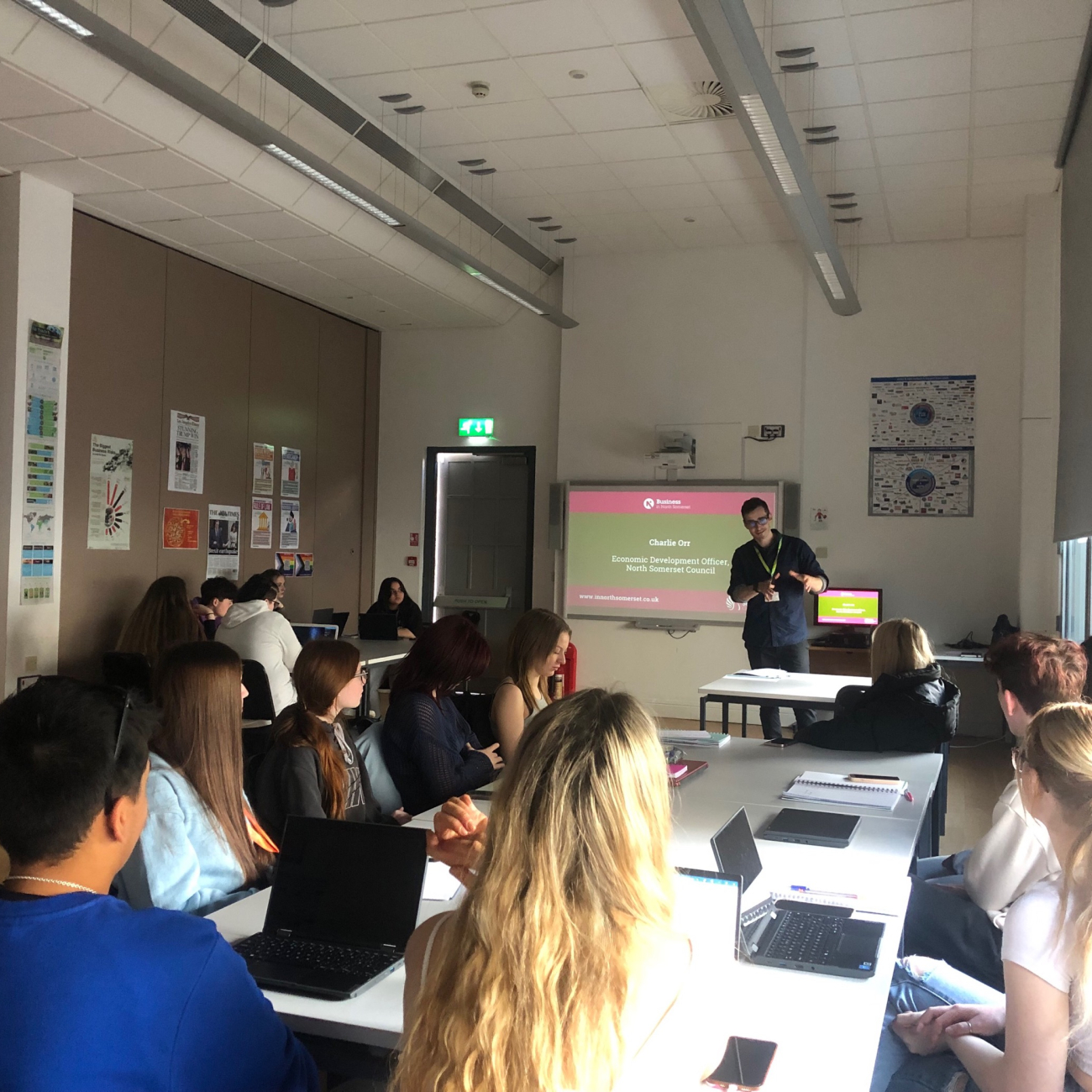 Charlie stood at front of classroom delivering a guest talk