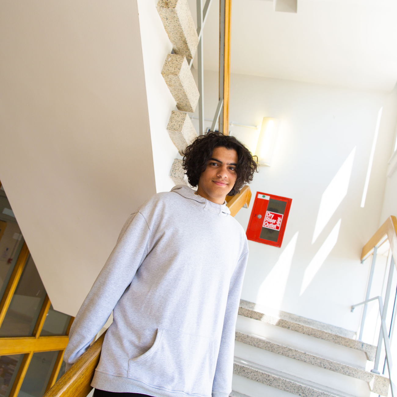 Mohammed standing on the staircase