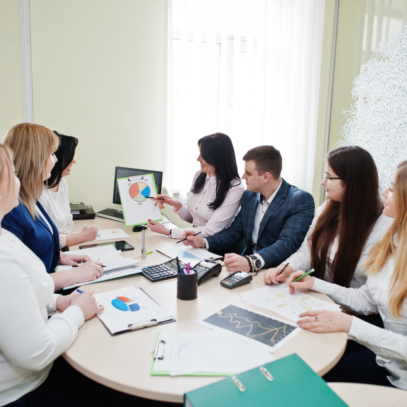 Bankers sitting at table in meeting