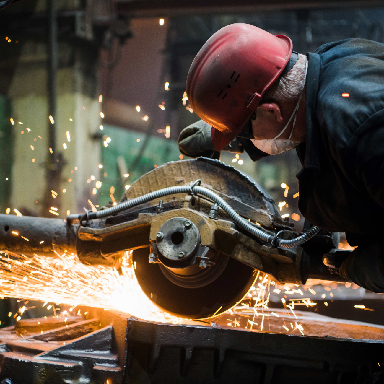 Engineer welding metal