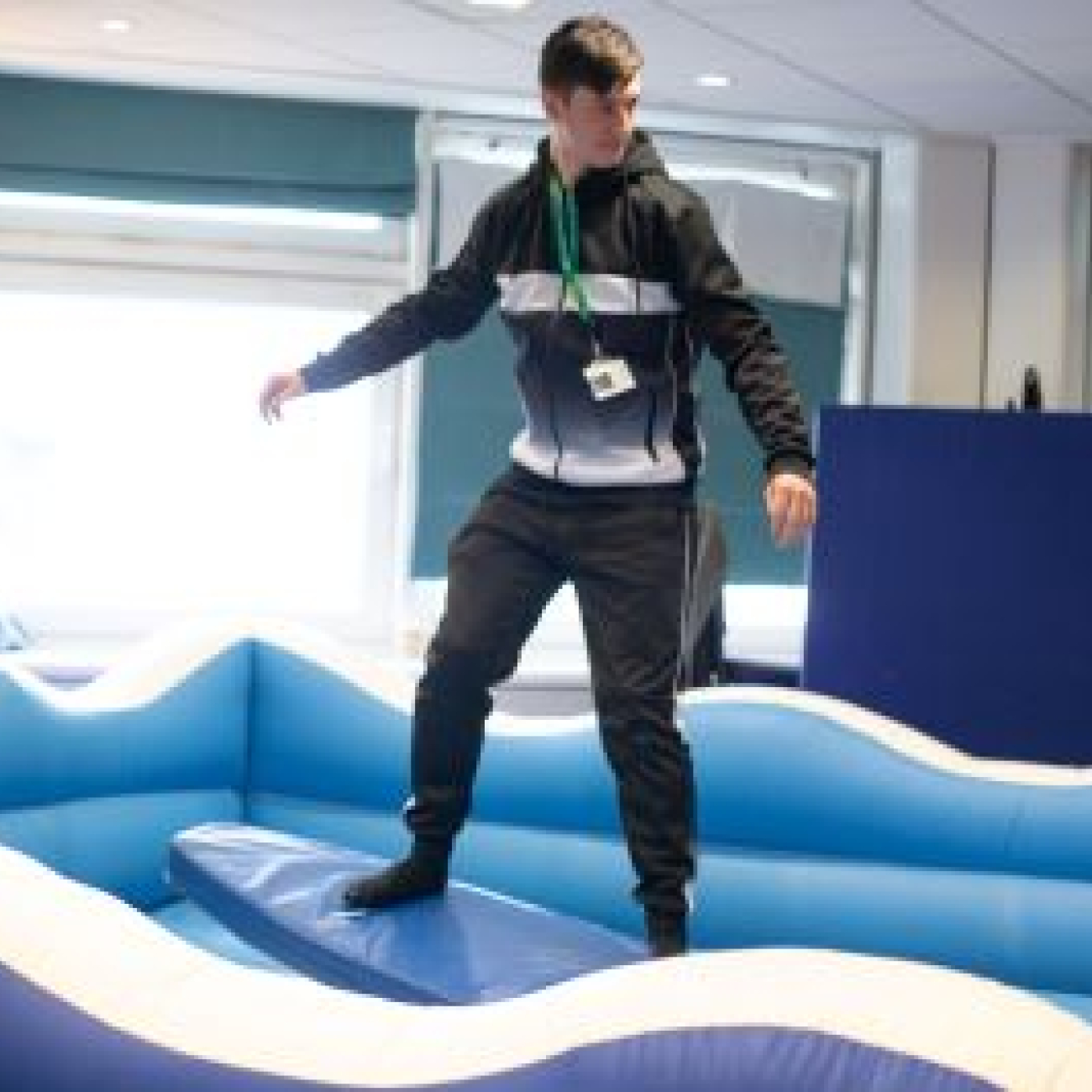 Learner having a go on the surf machine