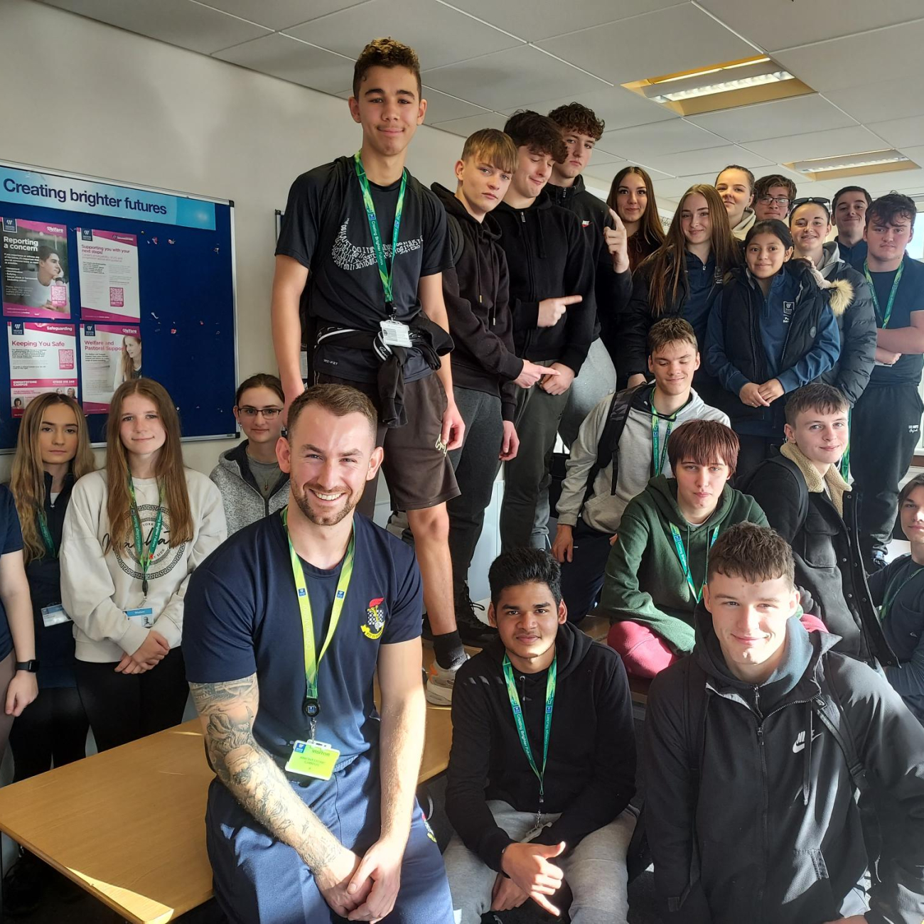 Group photo of public services learners and Tony Wilson