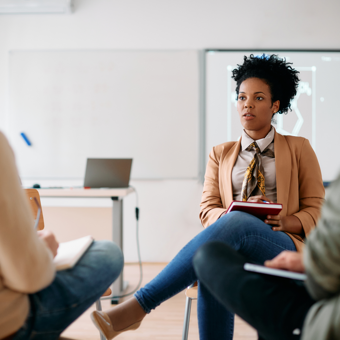 three business people in a meeting