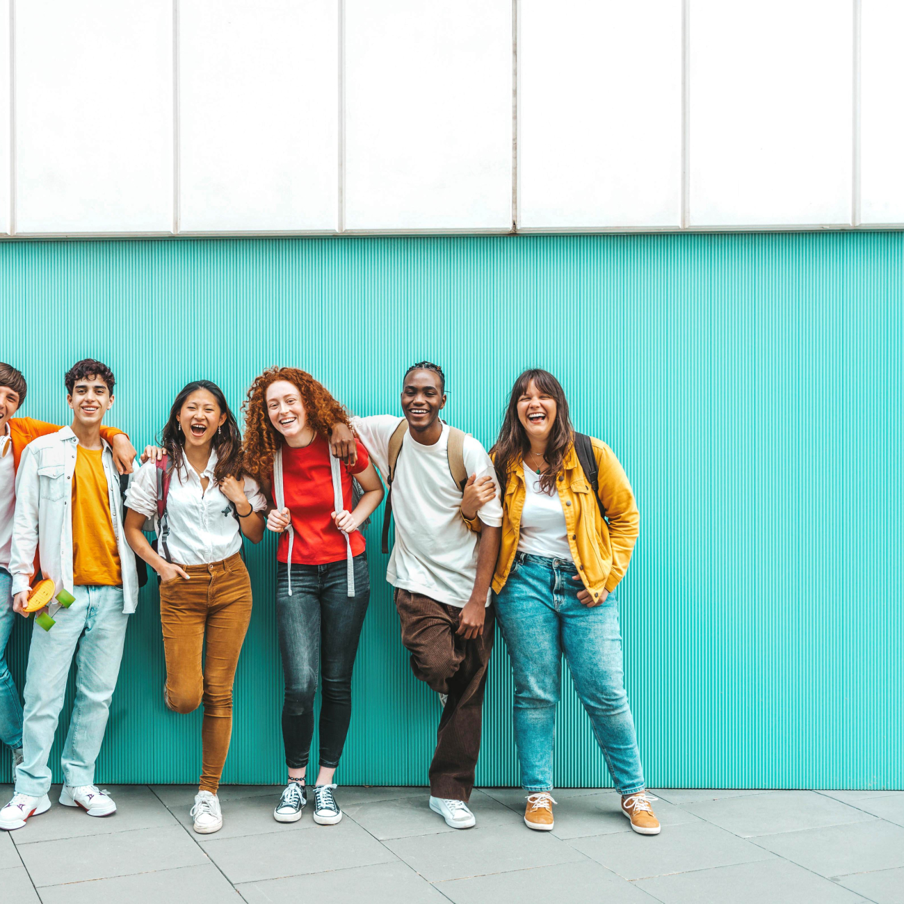 7 learners stood against the wall