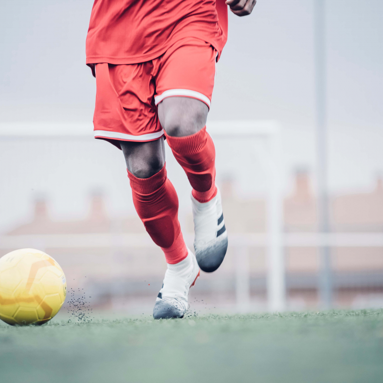 Football player kicking a football