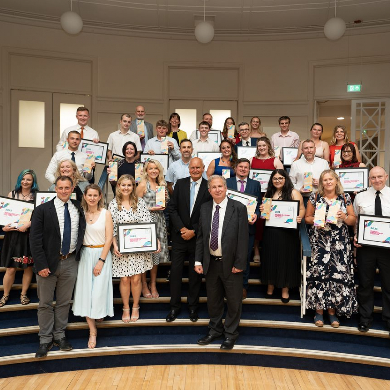 Winners from the Weston College Business Awards gathered together on the steps holding their award