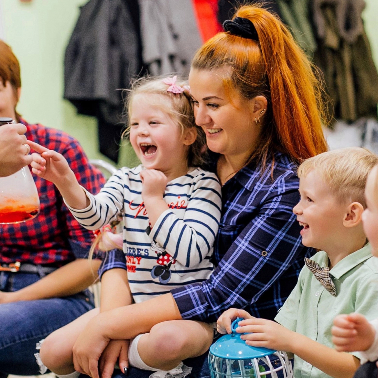 female student playing with children
