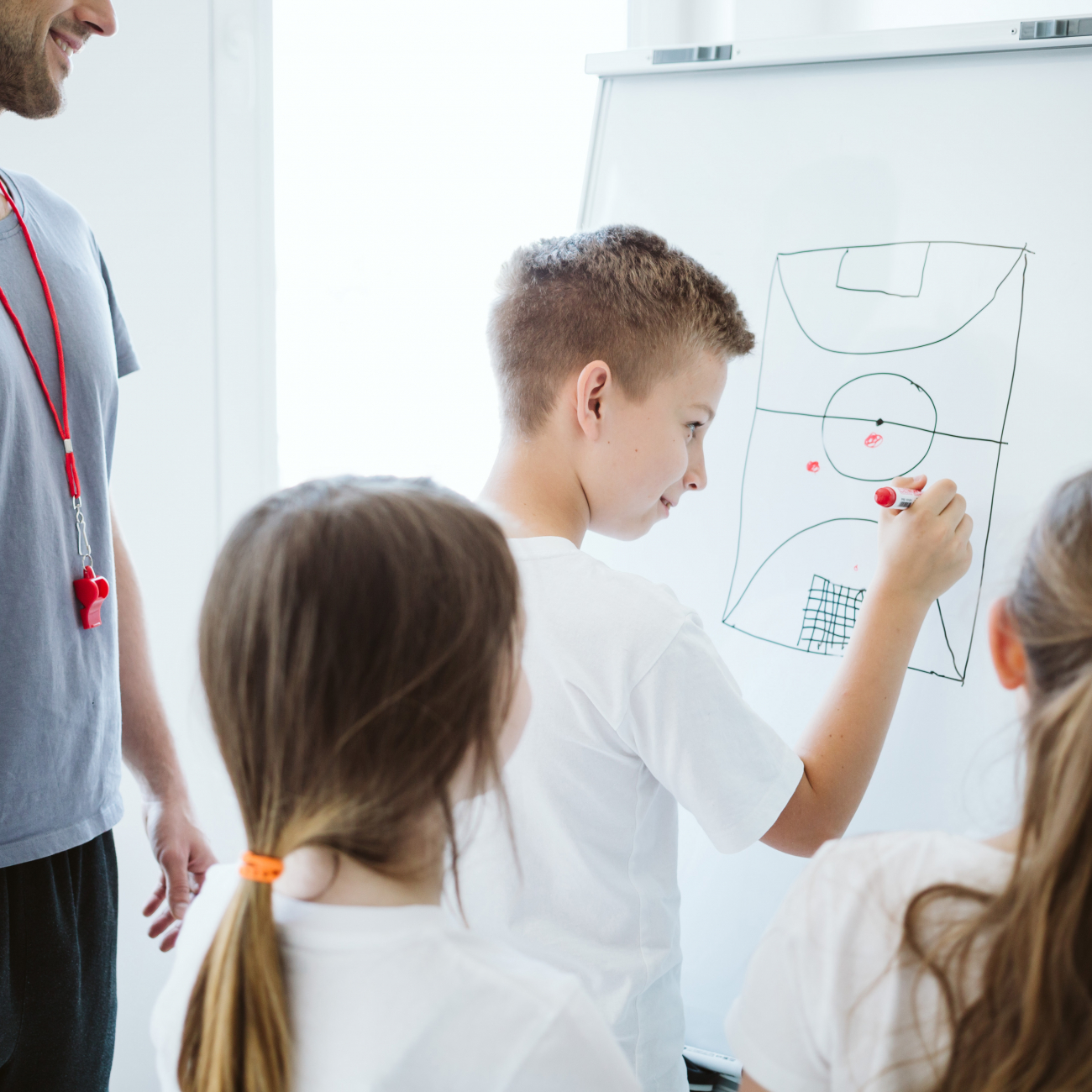 Young boy planning sports tactics