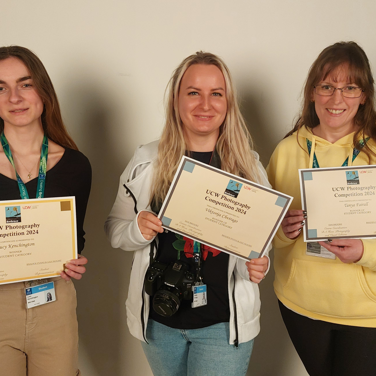 Students holding certificates