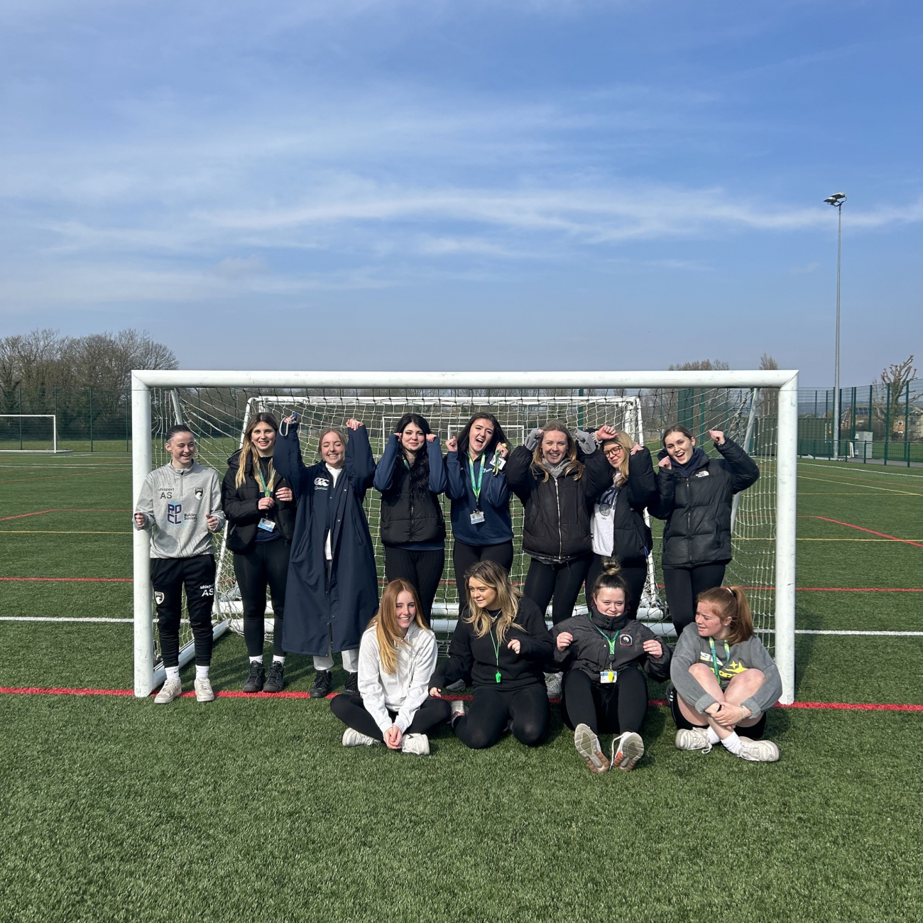 Girls in goal smiling for a picture