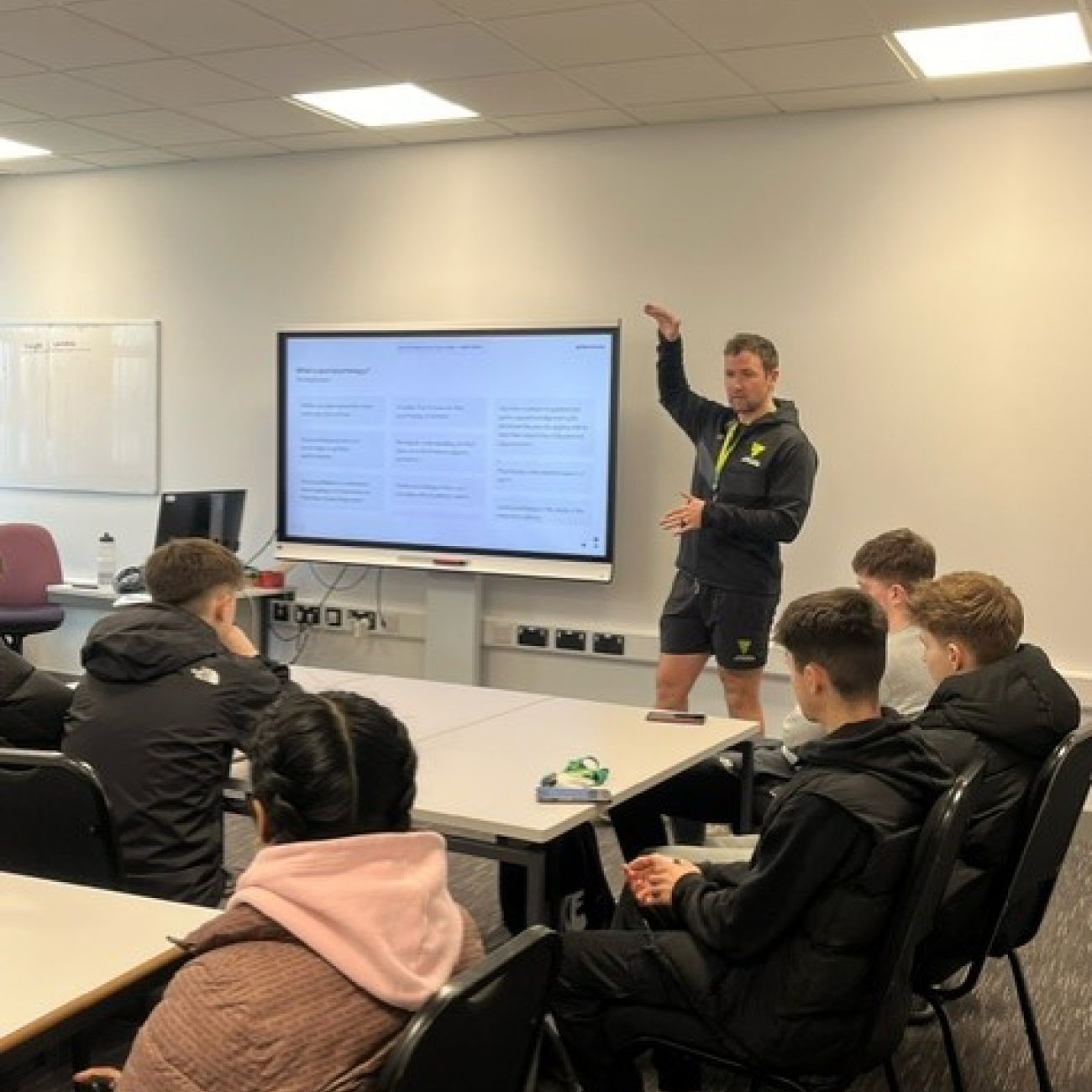 Marcus Nel delivering a workshop to the sports students in a classroom