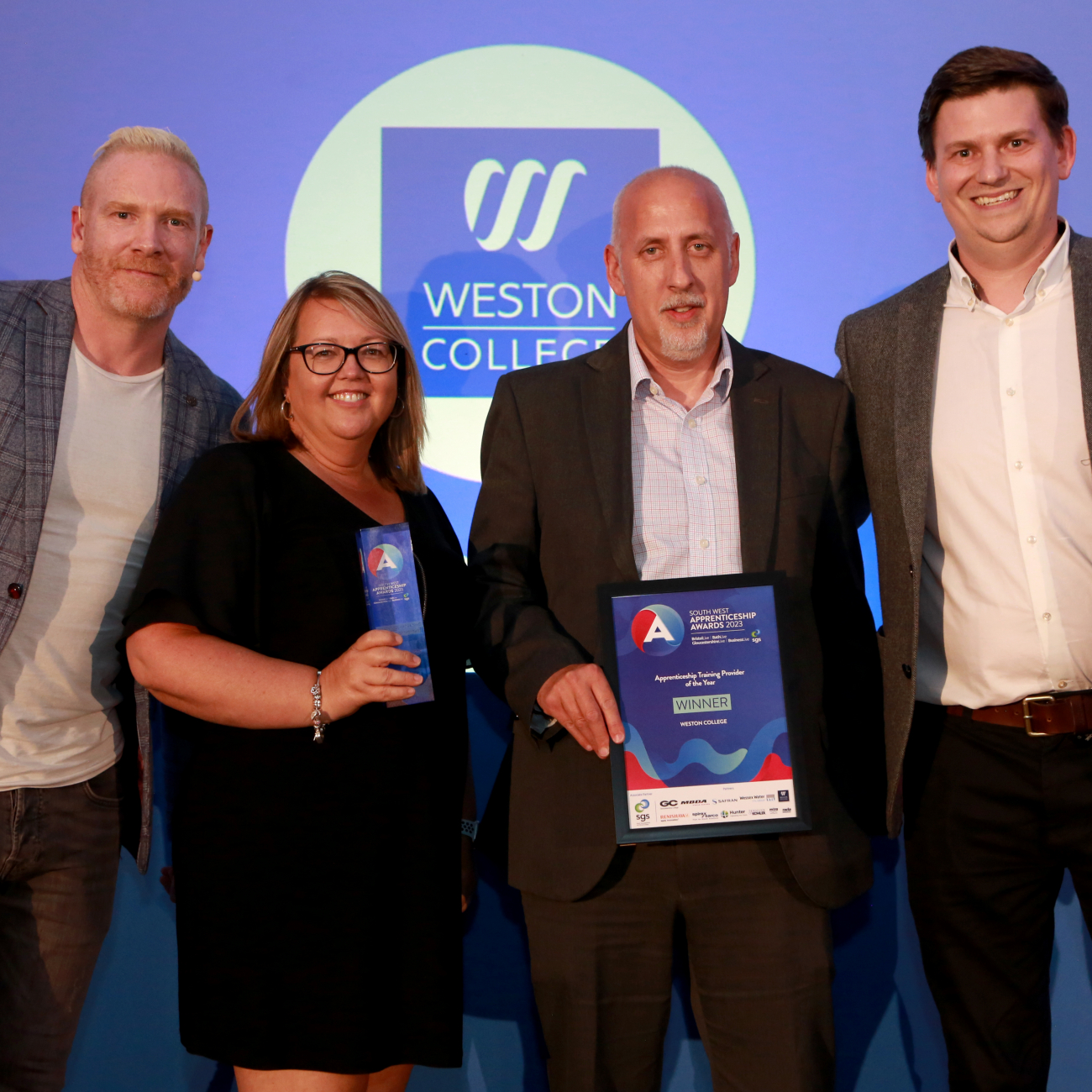 Weston College staff accepting an apprenticeship award