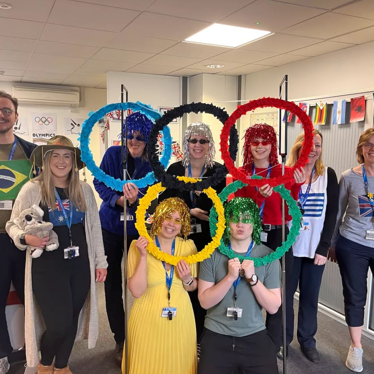 the C.I.S team standing with their self made tinsel olympic rings