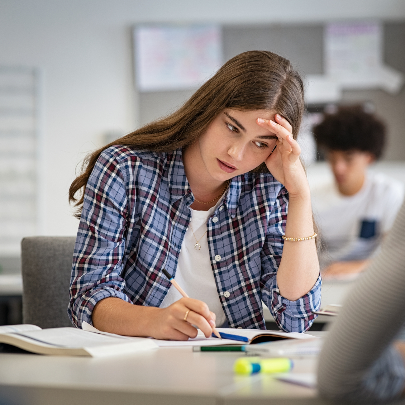 Stressed female student taking an exam