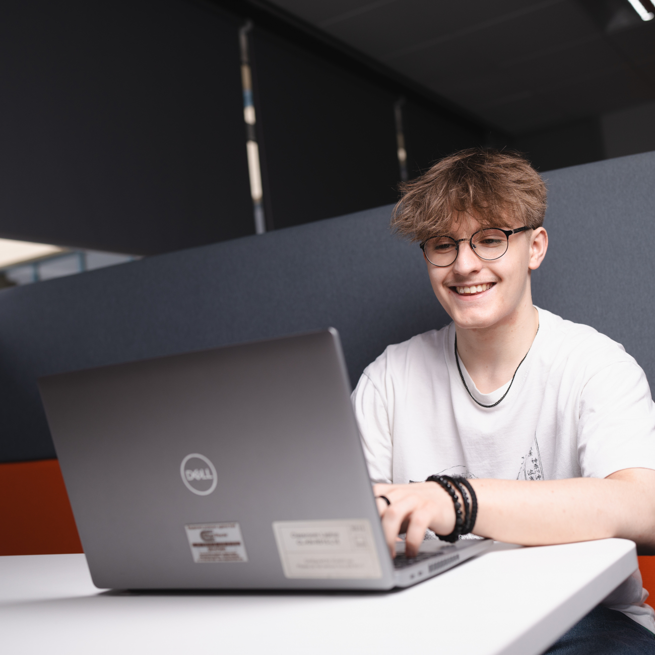 Tom on laptop.