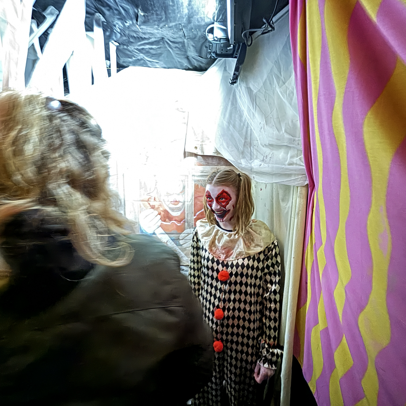 Performing Arts student dressed as a clown and scaring the public