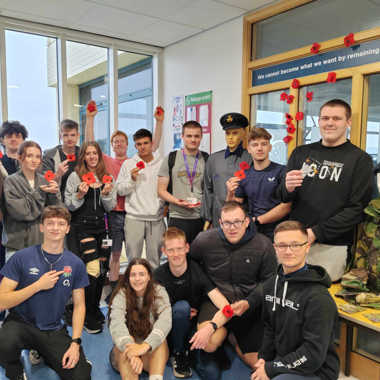 Protective Services learners group photo with the poppies they made