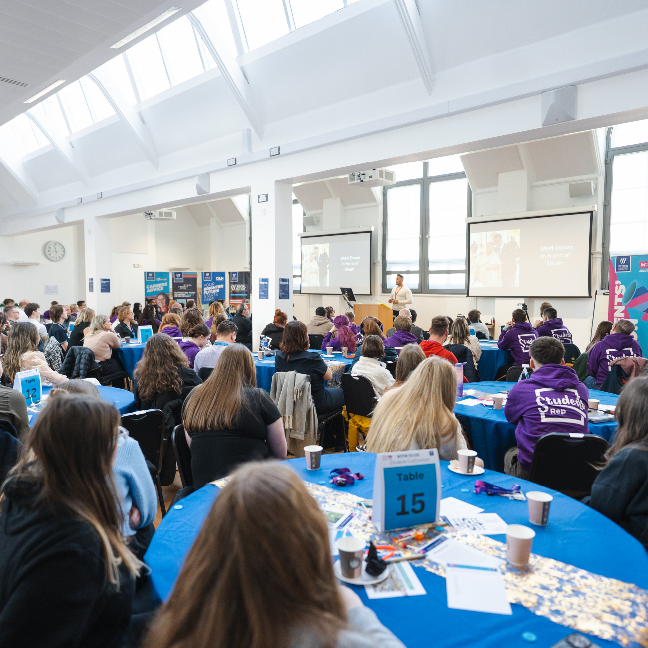 Students facing the front of the room listening to Adz Khan