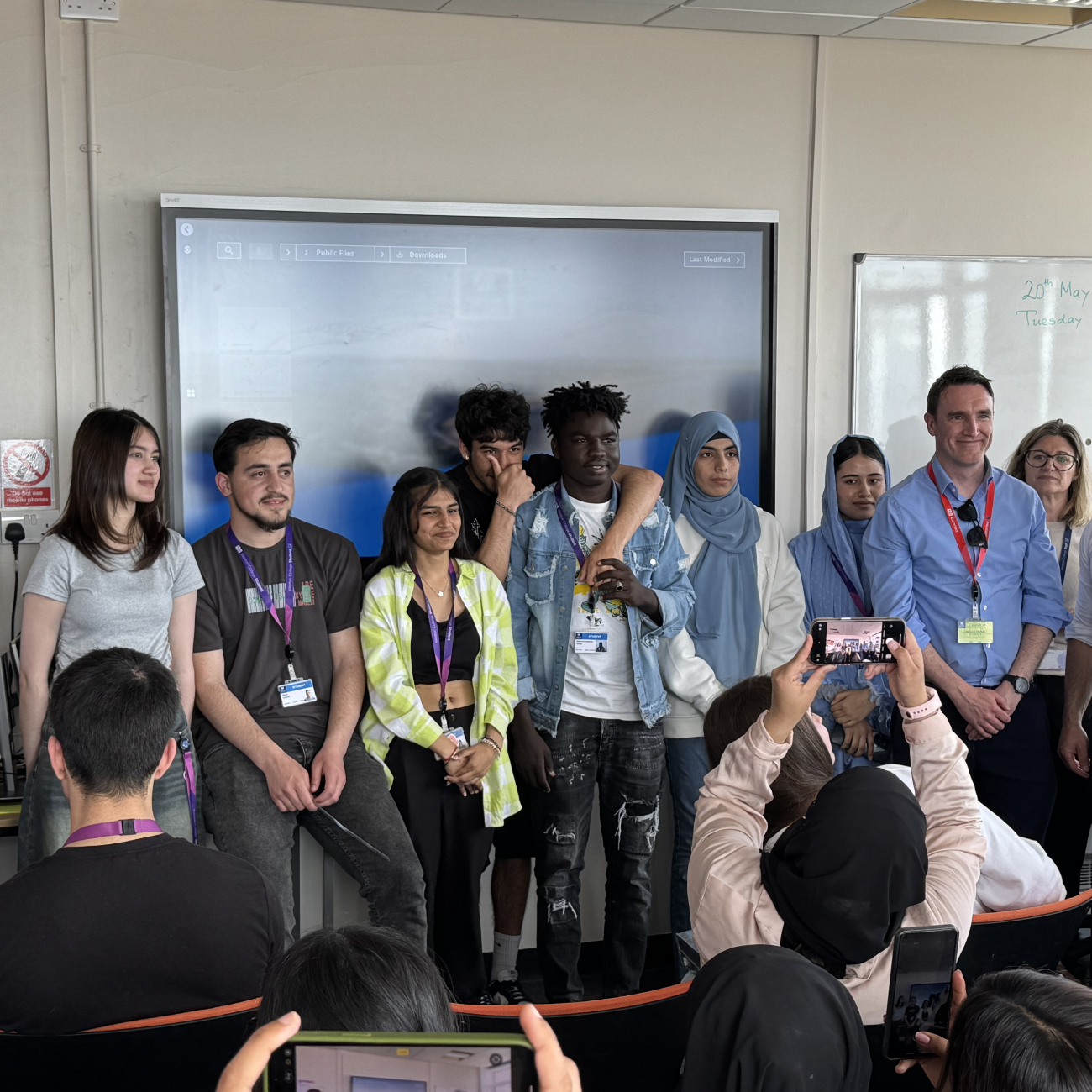 ESOL Students and panel smiling