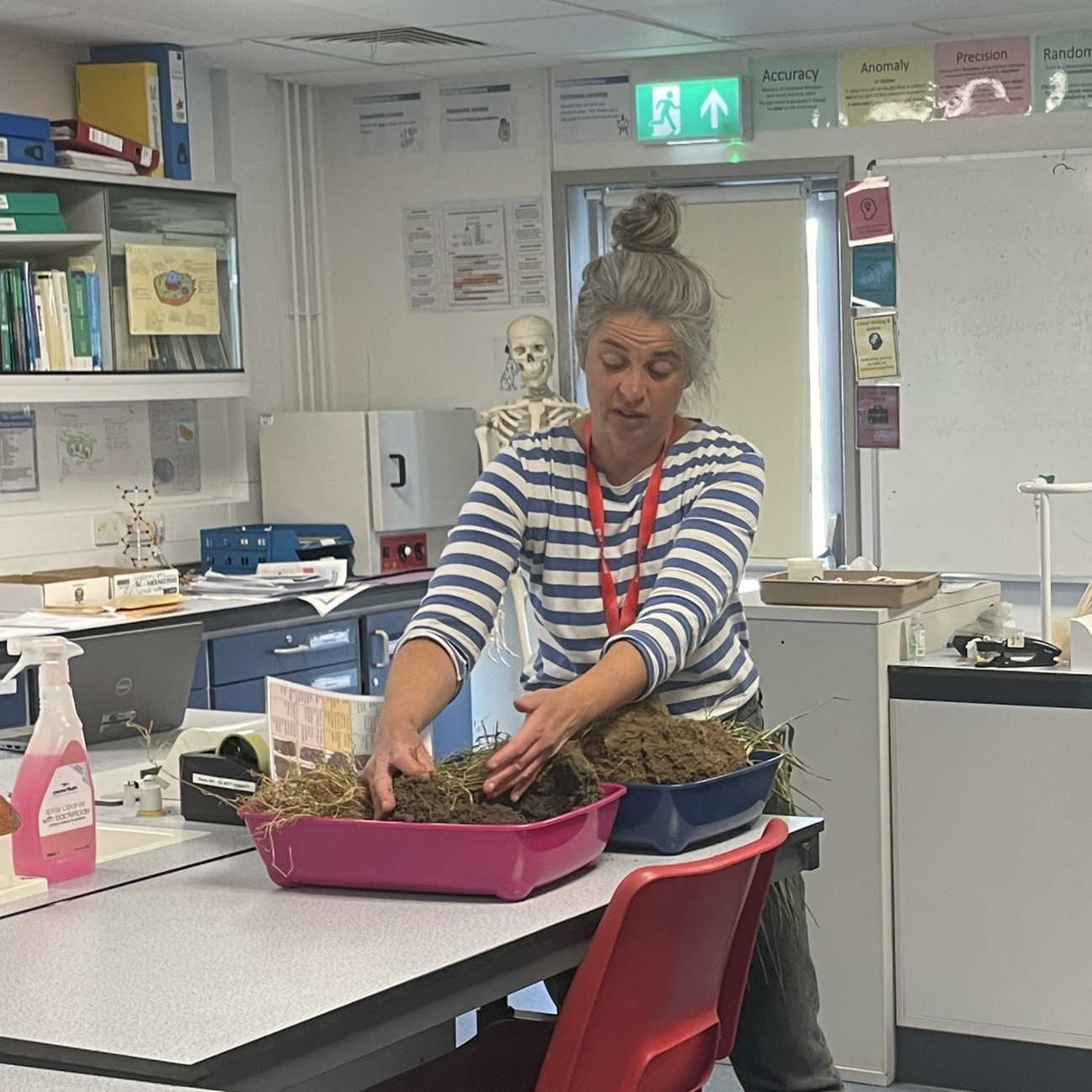 Kate from the Soil Association showing students 2 different types of soil