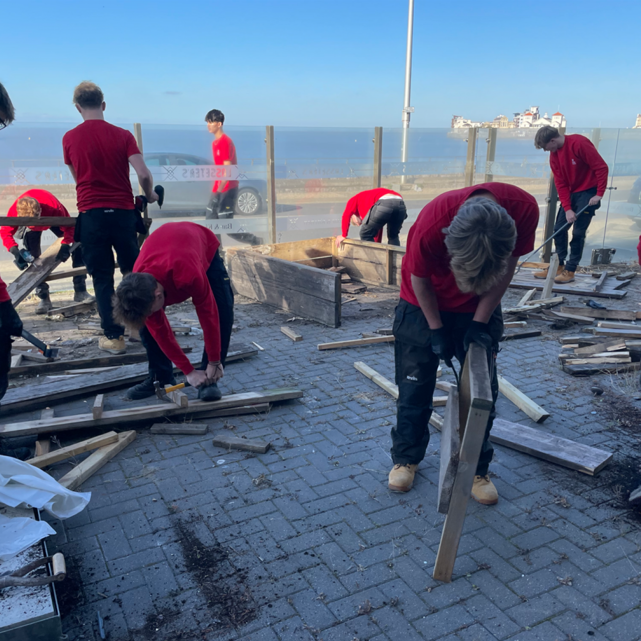 Carpentry students taking apart the Lasseter's benches