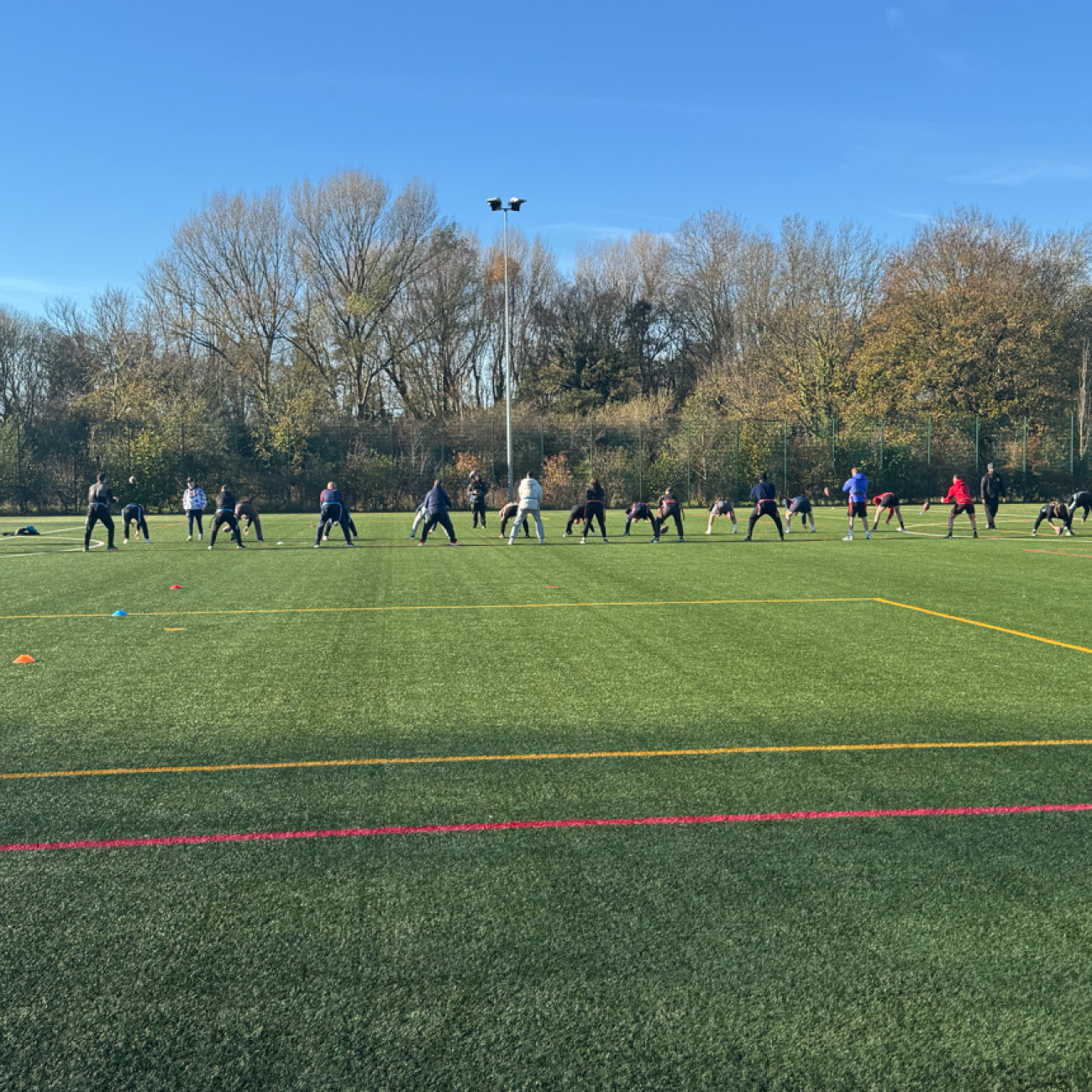 Staff waiting to catch the ball during training