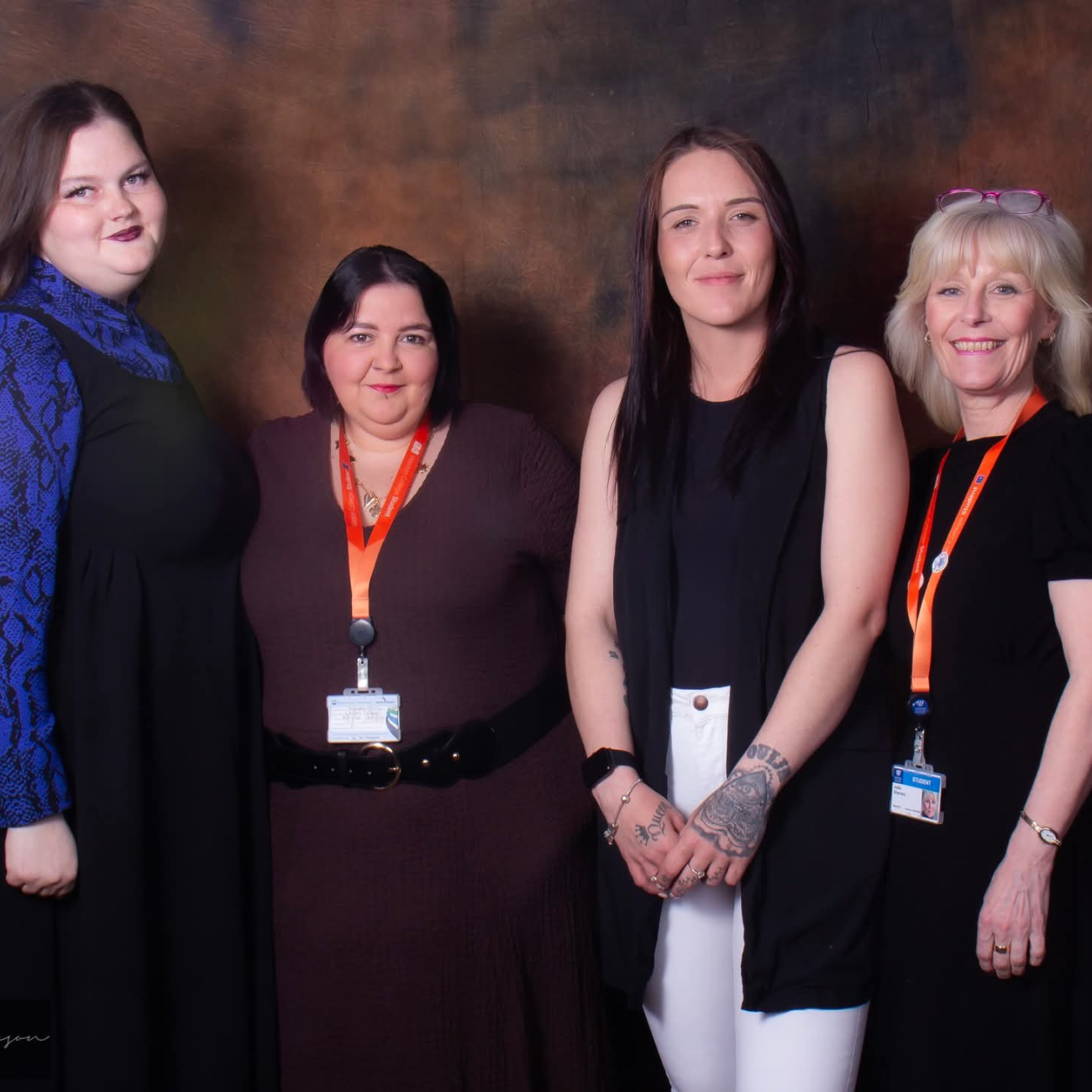 Four learners having photo taken