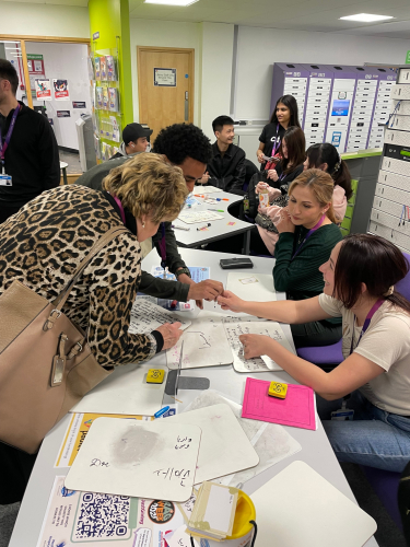 ESOL students writing names in their language