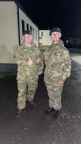 Dean and another Army cadet person standing in uniform