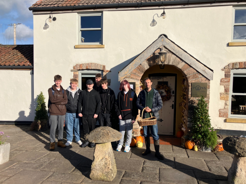 Students standing in front of the restaurant