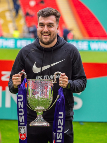 Isaac holding the trophy