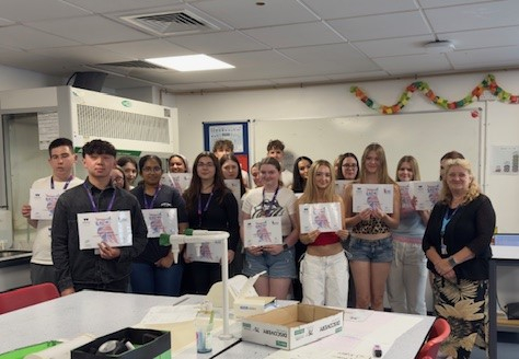 Group of biology students holding their certificates