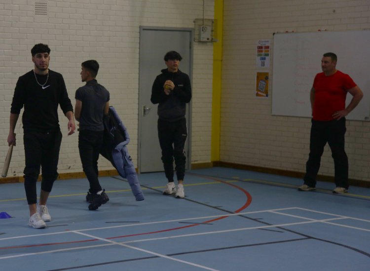 ESOL Learners, police and the fire brigade playing rounders.