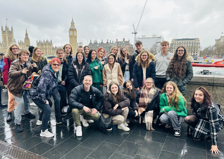 Performing arts student posing in front of the Thames with the Big Ben in the background