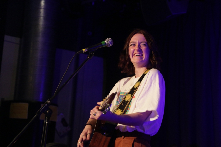 Music learner Daisy Dennett playing for Michael Eavis in Weston College Performance Suite