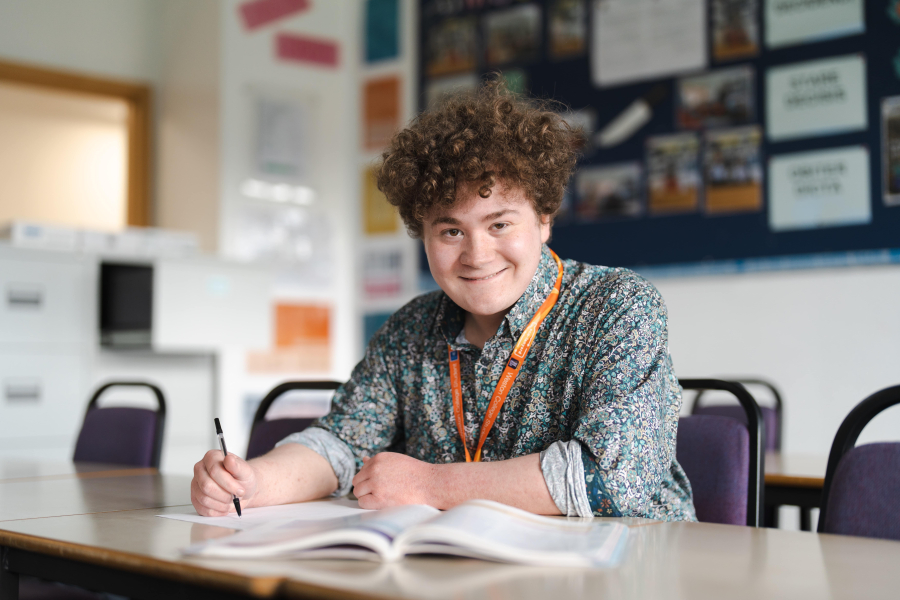 harrison byrom sitting and smiling