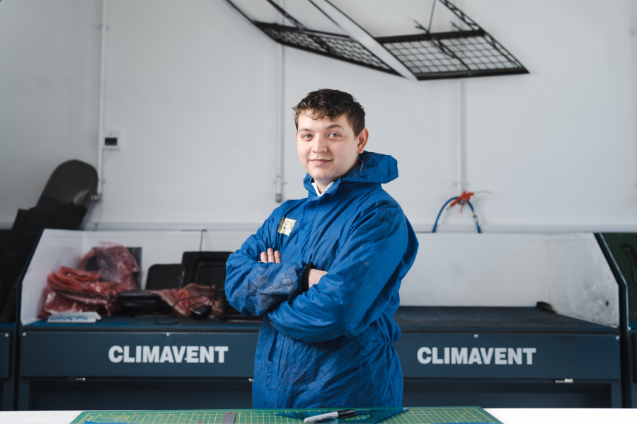 student wearing overalls studying engineering at weston college near bristol