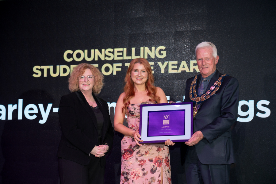 Carley collecting award