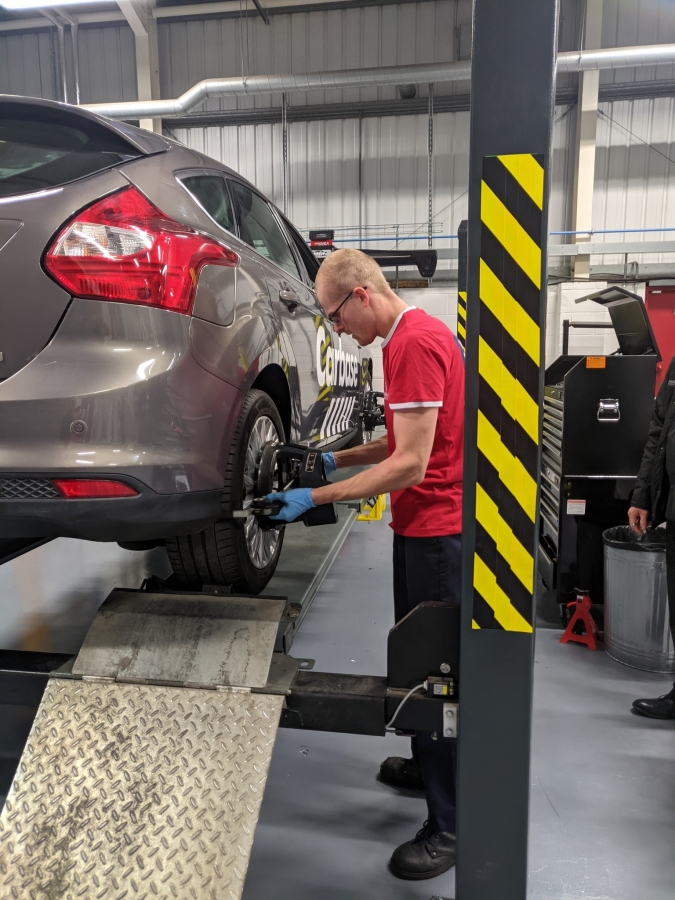 Luke fixing car